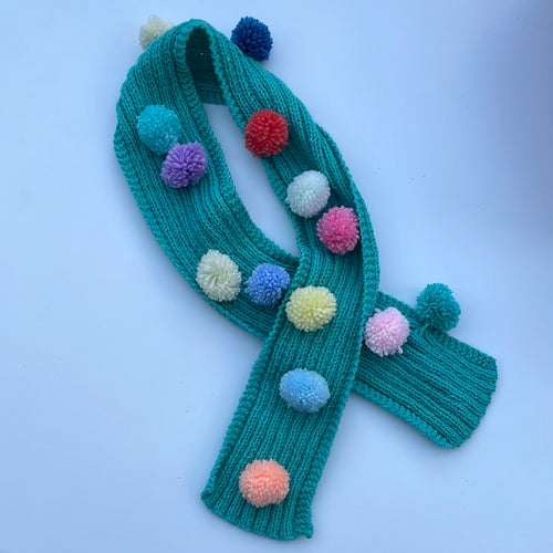 Hand knitted pom pom scarf 3-6yrs