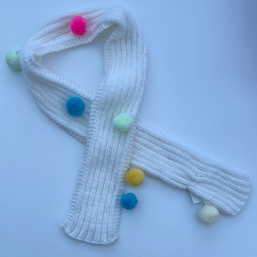 Hand knitted pom pom scarf
